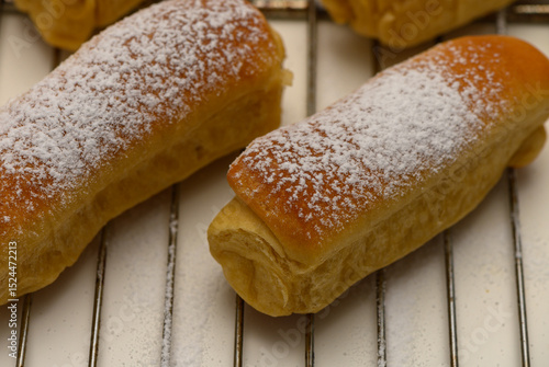 фотографія Golden Parker House Rolls Cooling After Baking on Rack