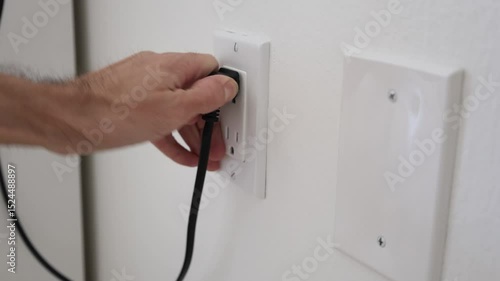 Taking out electricity plug from outlet