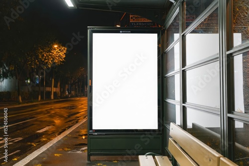 Mock up of blank advertising billboard or light box showcase poster template on city bus shelter.