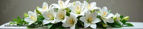 A serene arrangement of white lilies, roses, and orchids rests in a simple, elegant casket spray Perfect for sympathy, remembrance, and funeral service imagery , elegant, flowers, solemn