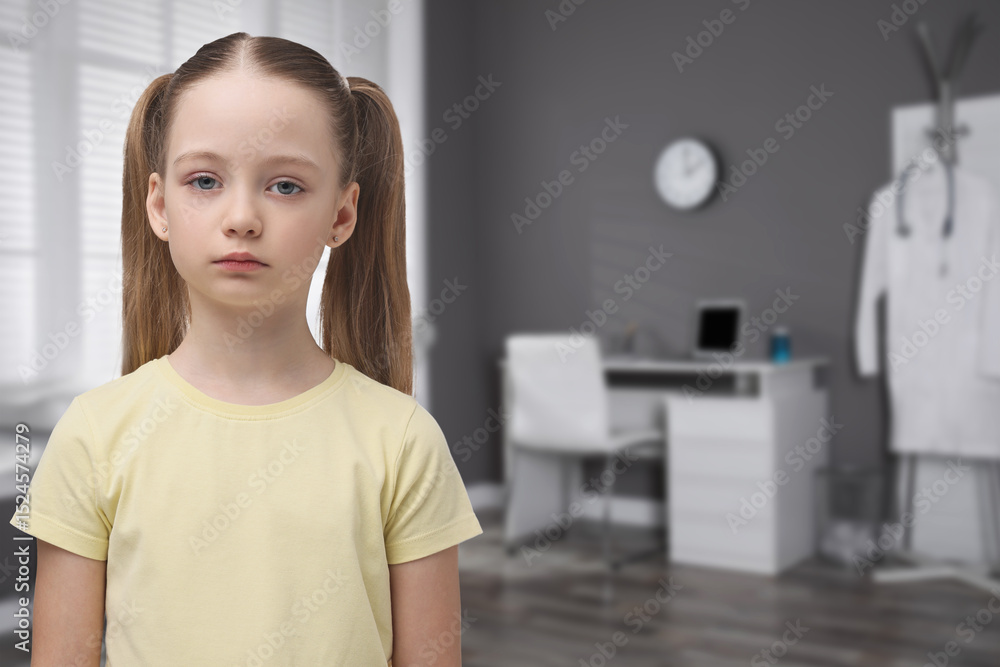 Sad little girl in children's hospital. Space for text Sad little girl in children's hospital. Space for text