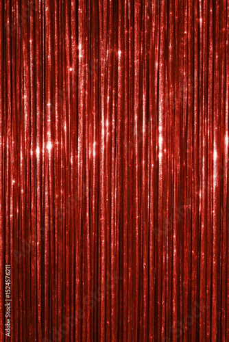 Shimmering red tinsel curtain with sparkling festive texture for party decoration