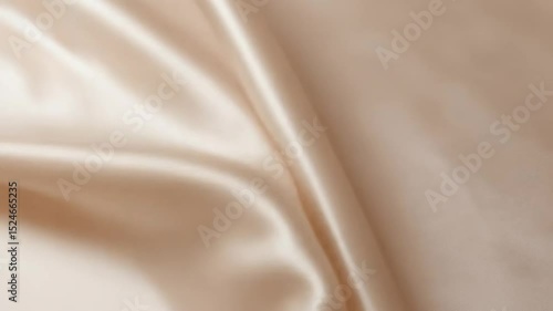 Flowing Beige Silk Fabric: Abstract Motion and Gentle Ripples