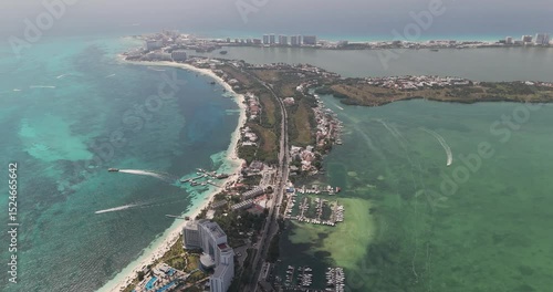 Cancun's hotel zone, beach, and lagoon on a beautiful sunny day with clear waters
