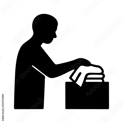 Person folding clothes into storage box icon