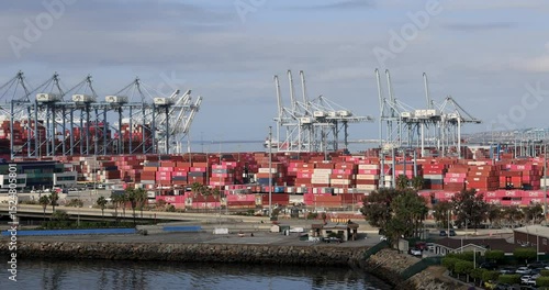 Long Beach California container cargo port cranes train. Long Beach container port. Gateway for US, Asian and China trade. Busiest largest cargo port facility on west coast of USA.