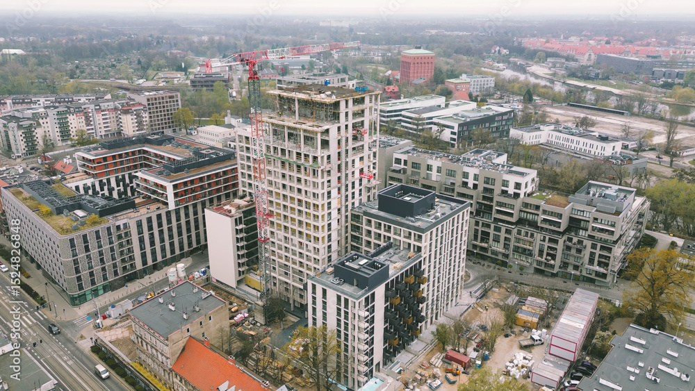 Naklejka premium City expansion with tower and construction crane