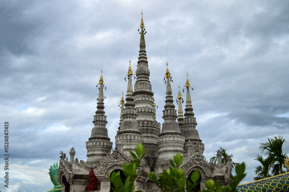 Fototapeta premium Pagoda in evening, Lanna Architecture, Symbols of Buddhism, South East Asia at Phra That Wisutthiyan Temple (Trailaksanaram Forest Temple) Doi saket, Chiang Mai, Northern Thailand