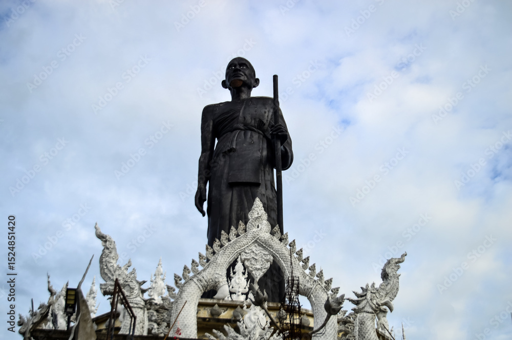 Fototapeta premium Black Buddha statue , Symbols of Buddhism, Southeast Asia, at Phra That Doi Khu temple, Doi saket, Chiang Mai, Northern Thailand