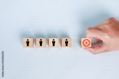 Foto Hand selecting wooden cube with target customer icon