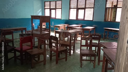 Wallpaper Mural the arrangement of desks and tables is messy, in a school classroom. Torontodigital.ca