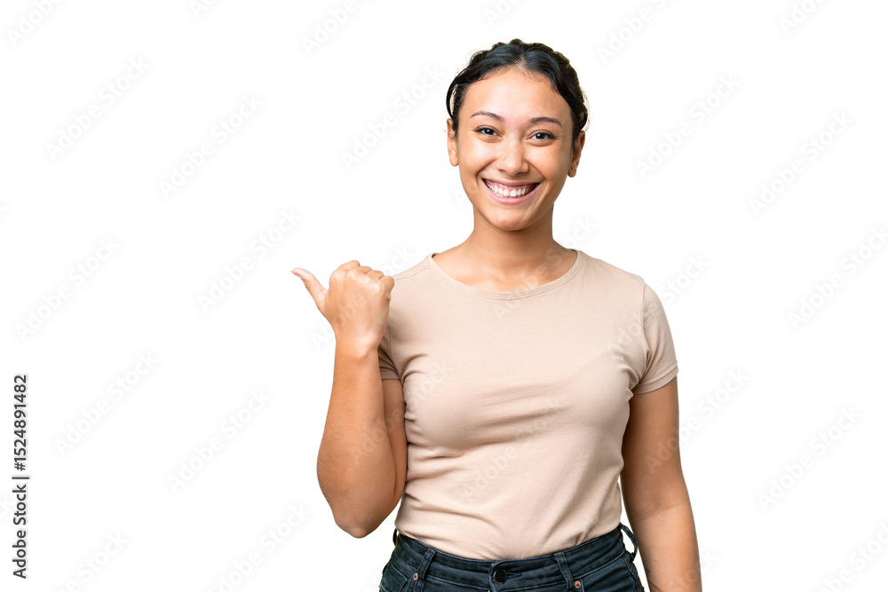 Fototapeta premium Young Uruguayan woman over isolated chroma key background pointing to the side to present a product