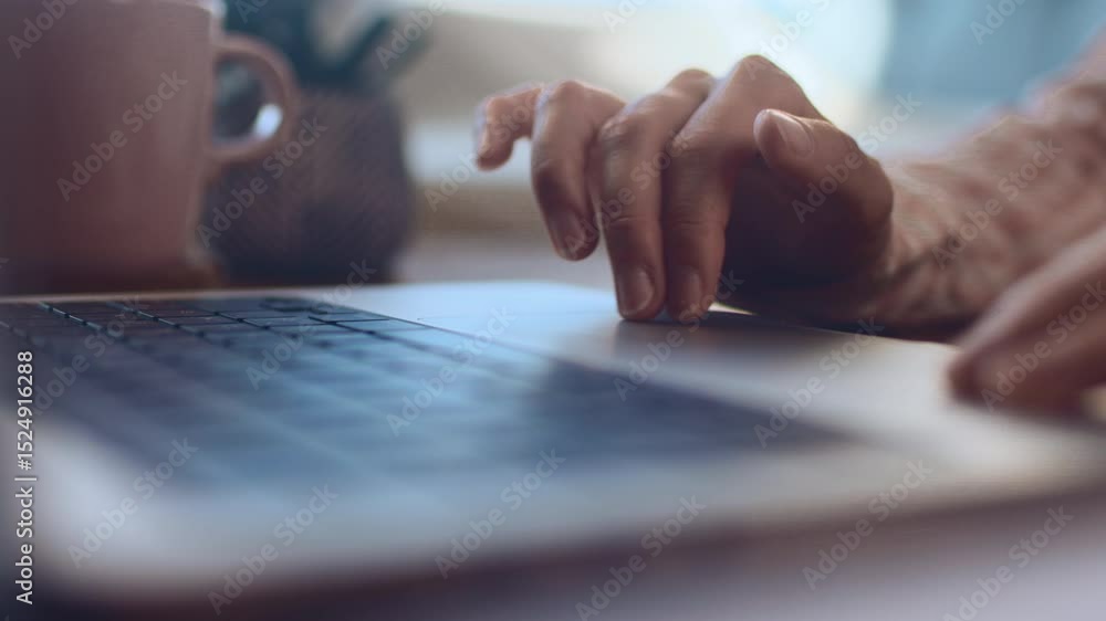 Close up of female finger using laptop trackpad scrolling website for online shopping and browsing. Distance learning, student hands close up with laptop, slow motion.