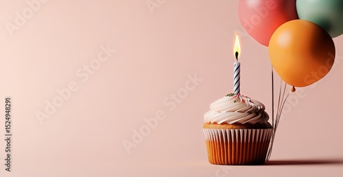 Delicious Cupcake With a Candle and Colorful Balloons for a Festive Celebration.