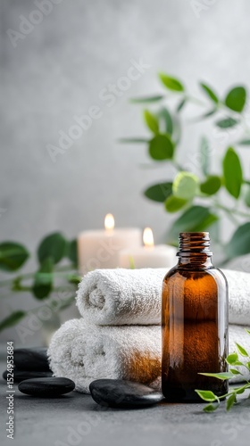 Spa Setting With Towels Candles and Essential Oil Bottle for Relaxation and W...