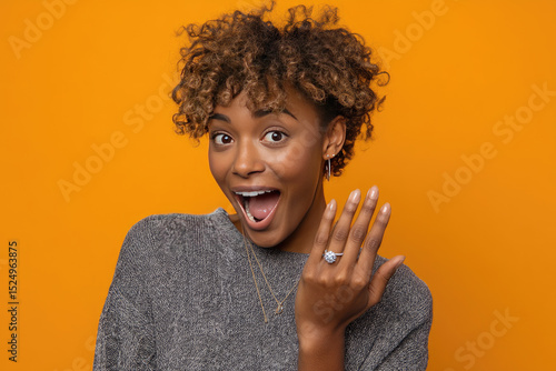 Woman showing off ring feeling happy and excited