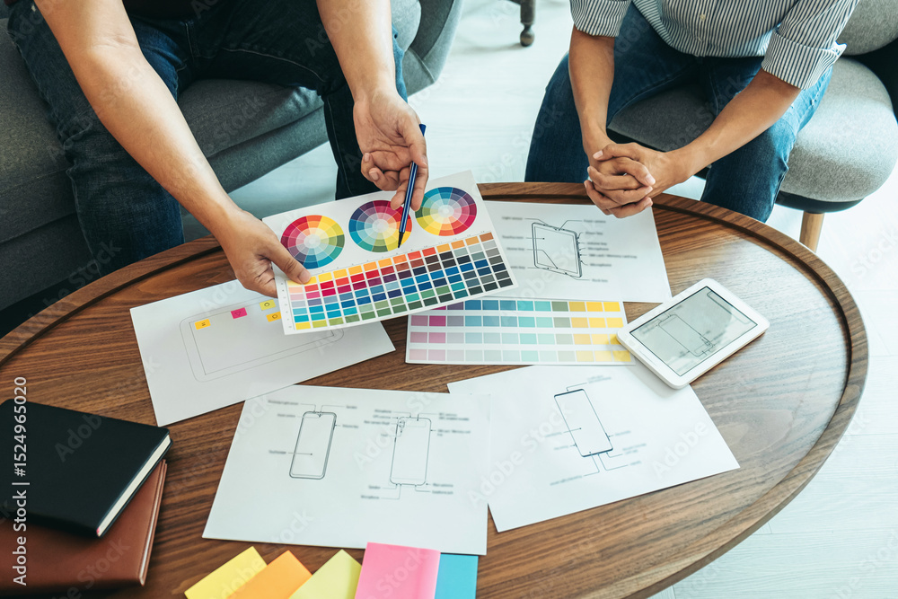 Fototapeta premium Team of Creative Web/Graphic Designer planning, drawing website ux app for mobile phone application and development template layout, process to developing prototype wireframe, User experience concept