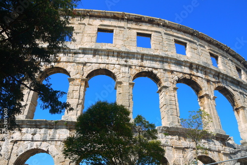 ancient Colosseum of Pula with clearly blue sky in summer vacation, Croatia