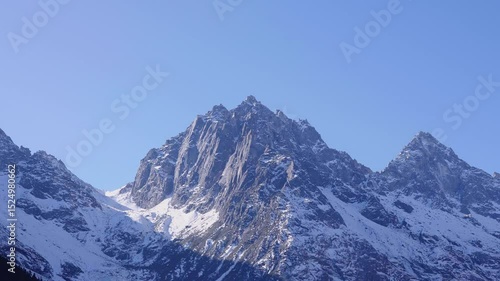 Wallpaper Mural Snow-covered mountains against a cloudless blue sky Torontodigital.ca