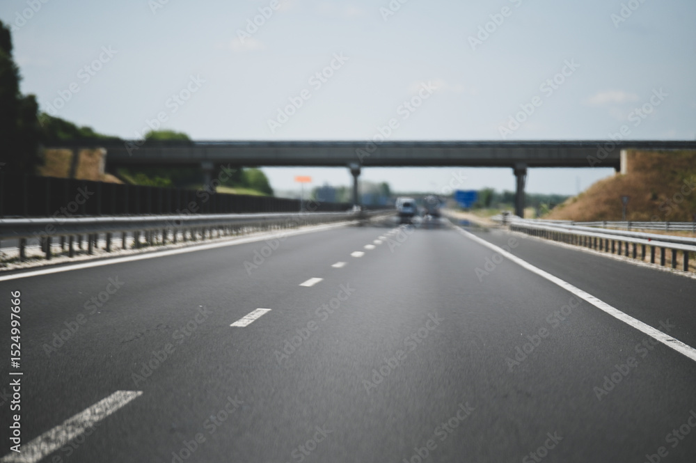 Fototapeta premium Driving on the highway. Asphalt. Traveling on the highway. Driver's view of the road.