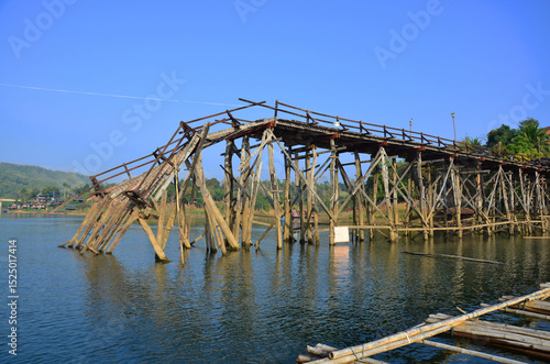 Ancient antique Saphan Mon or Uttamanusorn longest wooden bridge damage broken from flash flood in Songkalia river for thai people traveler travel visit at Sangkhla Buri city in Kanchanaburi, Thailand