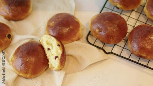 Removing Hot Raisin Buns from Oven and Cooling on Rack