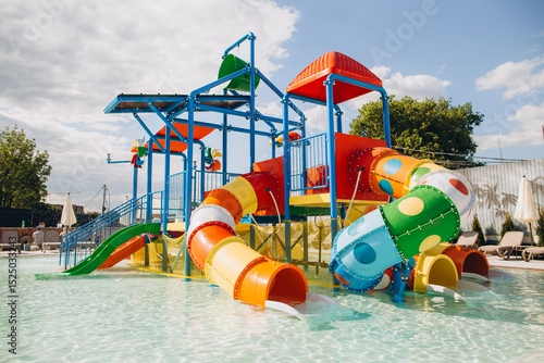 Wallpaper Mural Colorful water slides and play structure inviting children to aquatic fun Torontodigital.ca