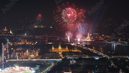 Colorful fireworks light up the night sky over bangkok, thailand, illuminating the cityscape, Aerial view.