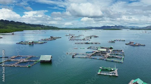 Aerial view of fish farm with cages for fish and shrimp. Fish farming aquaculture, Philippines, 4k
