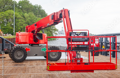 Four wheeled elevating work platform on an offshore vessel.