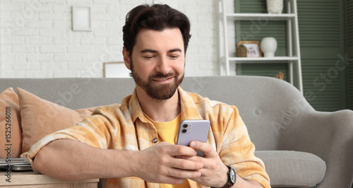 Handsome man using mobile p...
