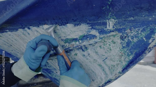 Antifouling scrap tool removing old paint boat hull to leave gelcoat clean