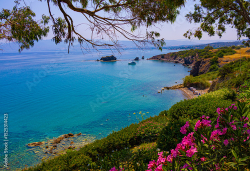 The Aphrodite's beach with flowers and trees near Mediterranean sea in Akamas peninsula in Cyprus