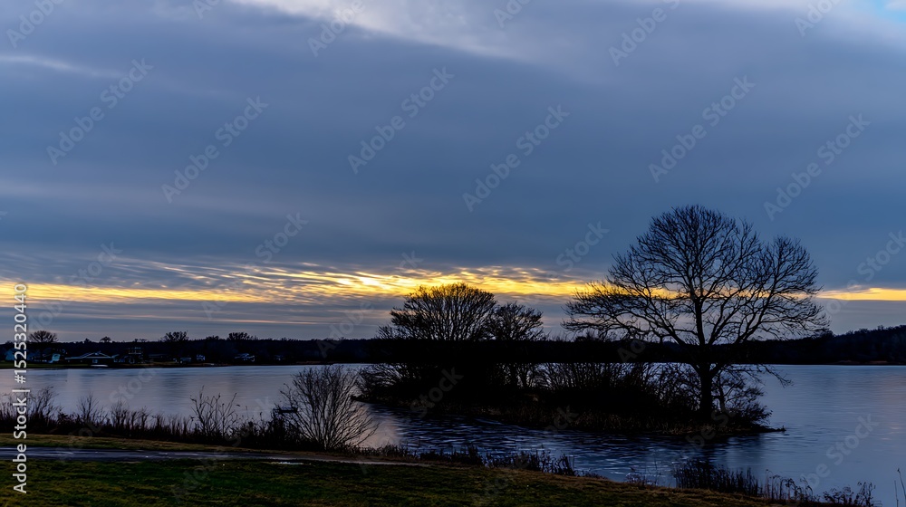 Fototapeta premium Gloomy landscape at dusk with lake