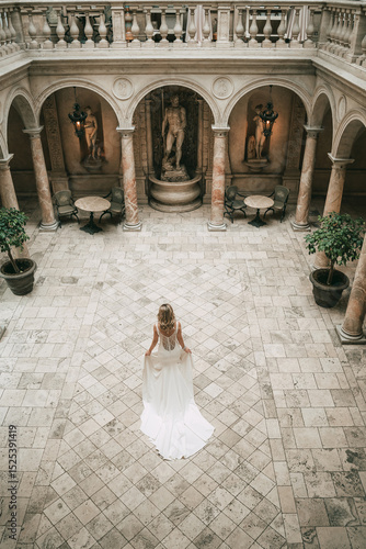 Overhead shot of bride in historic marble courtyard