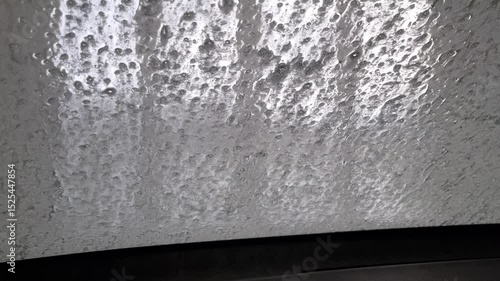 automatic car wash station in operation - inside car view