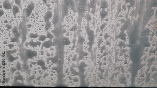 automatic car wash station in operation - inside car view