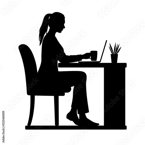Young woman working on laptop while sitting at desk with coffee  