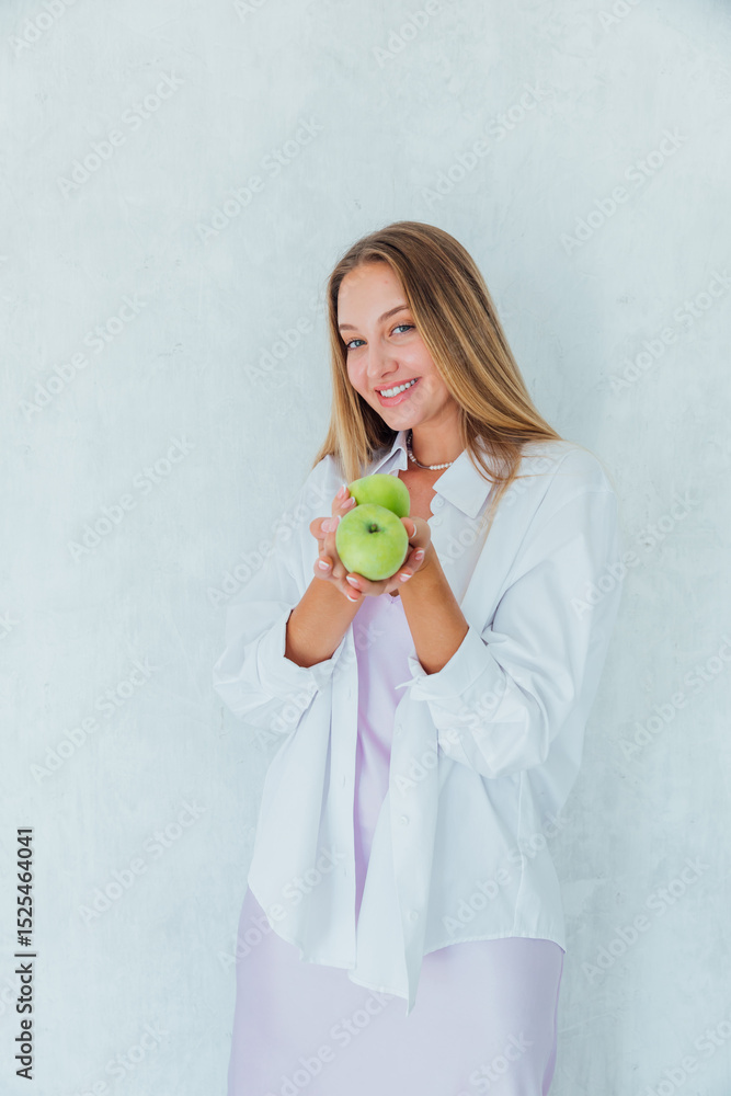 Beautiful woman holding green fragrant apples for diet Beautiful woman holding green fragrant apples for diet