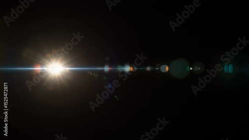 Abstract video of a bright light with lens flare effect on black background overlay