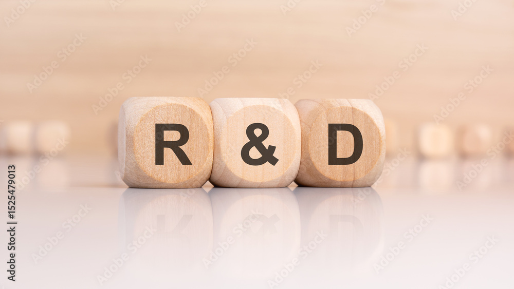 wooden cubes with R and D abbreviation on a smooth surface wooden cubes with R and D abbreviation on a smooth surface