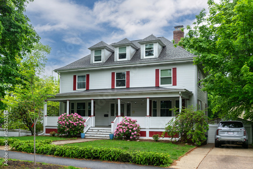Charming two-story suburban home with classic architectural details on a spring day in Newton, Massachusetts, USA