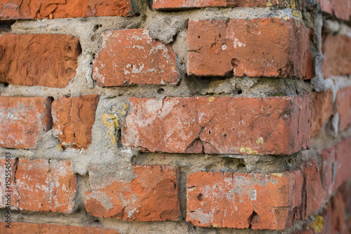 Close-Up of Aged Red Brick Wall Corner with Weathered Mortar Texture - Rustic Architectural Detail