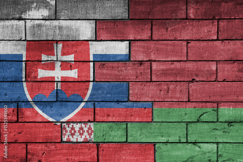 Photography colourful painted big national flag of belarus and flag of slovakia on a massive old brick wall background