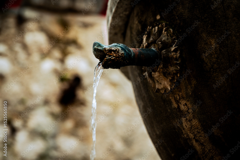 Naklejka premium St. Paul De Vence, France - July 3, 2014: A water fountain in the hillside village of St. Paul De Vence, France
