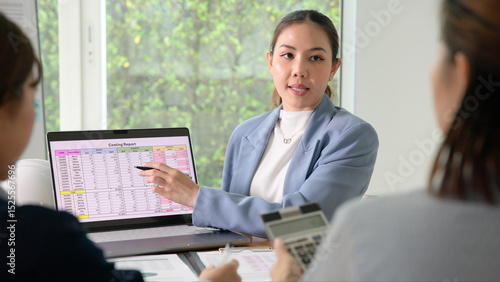 Slika na platnu Expert woman asian people discuss review data number costing managerial account prepare monthly actual cost variance report income tax at audit office