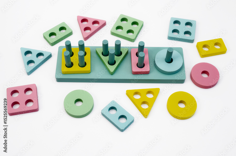 Fototapeta premium Montessori wooden toy with geometric shapes and stand on white background, educational game for preschoolers