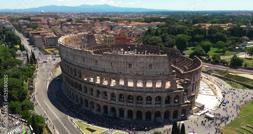 Epic Daytime Aerial of the Colosseum in Rome: Stunning Drone Footage Capturing Ancient History and Architecture in the Heart of Italy