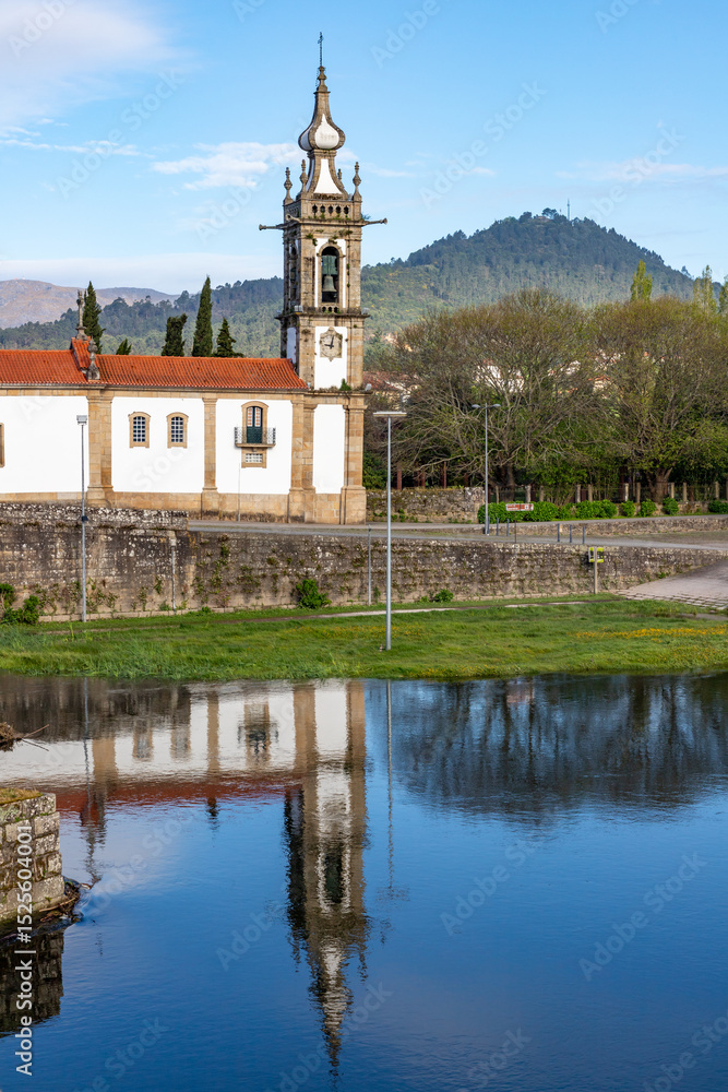 Fototapeta premium Medieval bridge and Church in Ponte de Lima