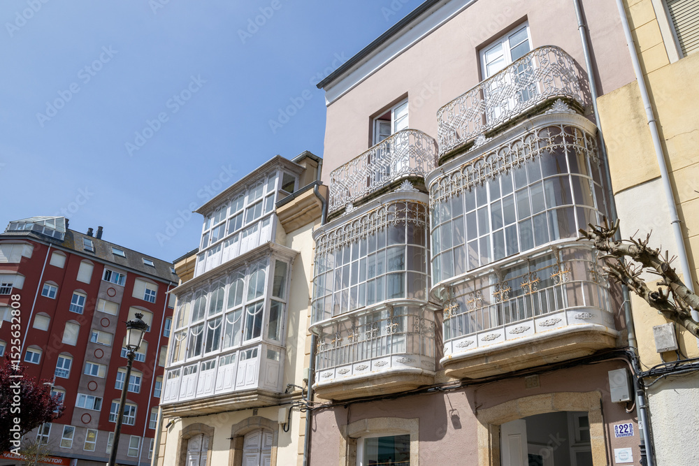 Fototapeta premium Ribadeo’s colorful town center in Galicia, Spain, viewed from the historic core, with charming facades, classic architecture, and urban atmosphere.